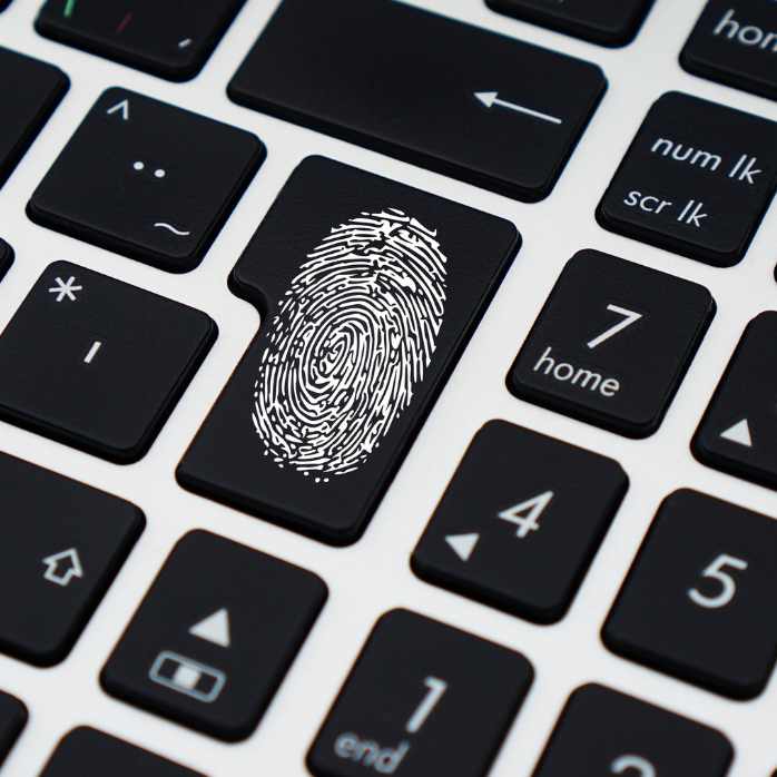A computer keyboard with a fingerprint on it to represent "computer security"
